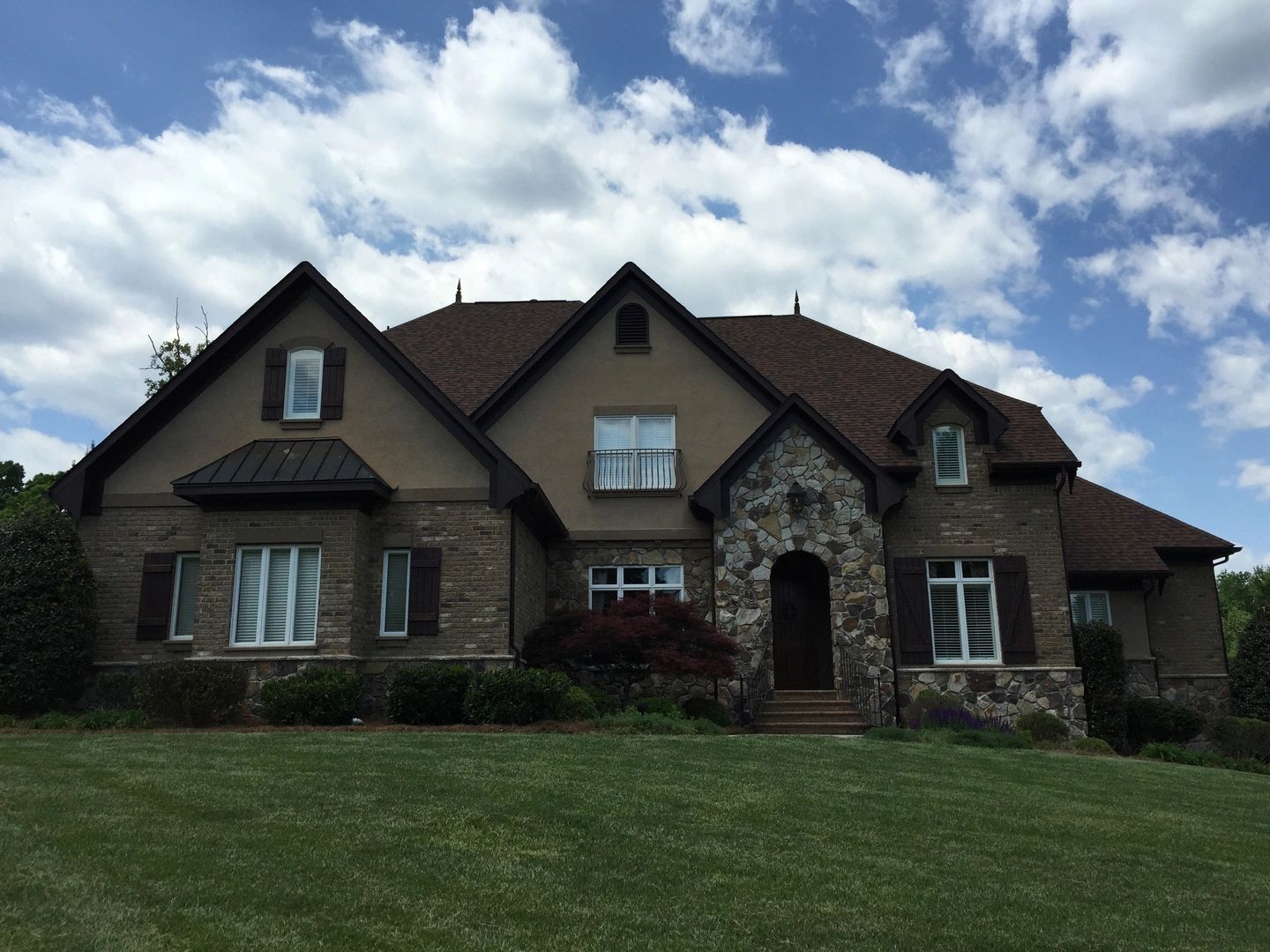 Represented home — stone and stucco estate
