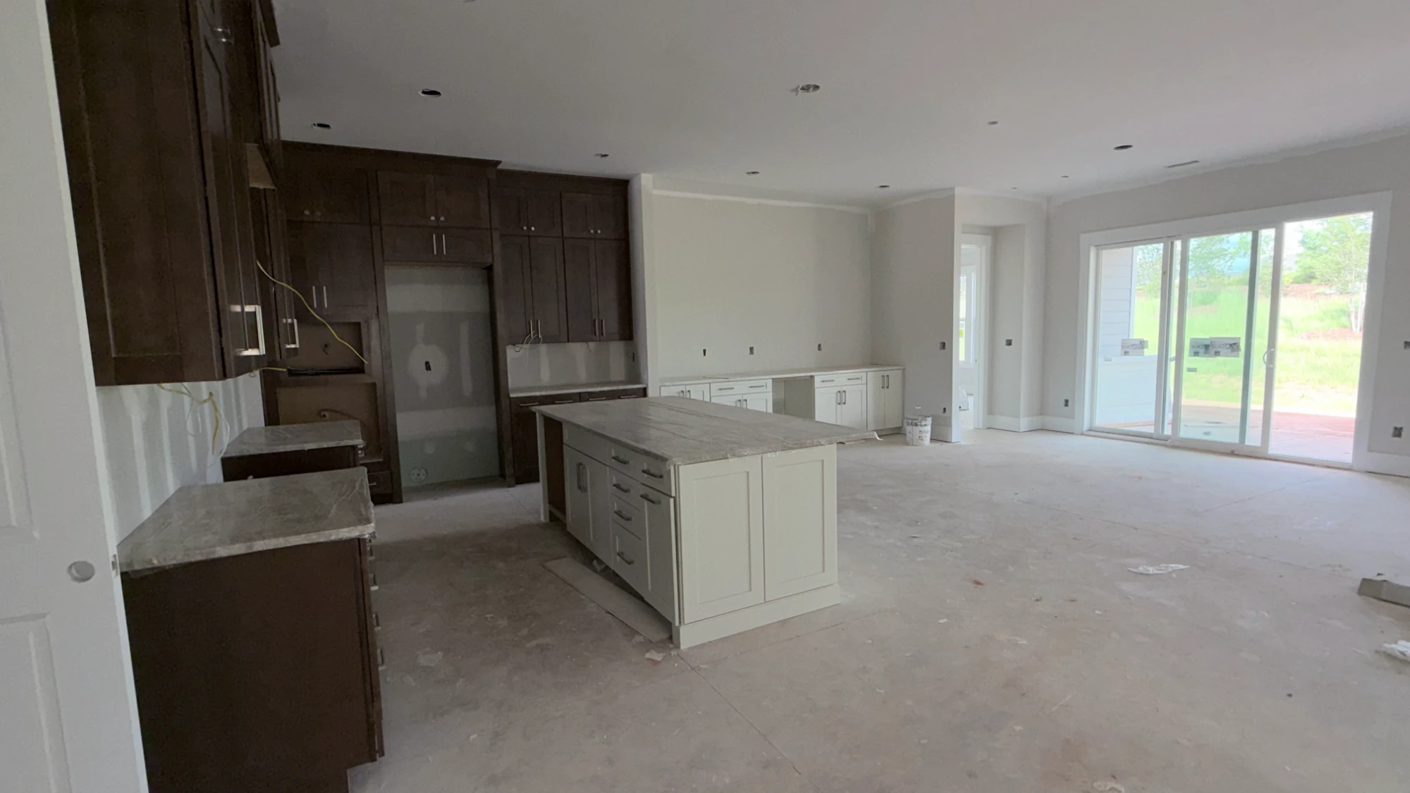 Kitchen during construction — island and cabinetry set