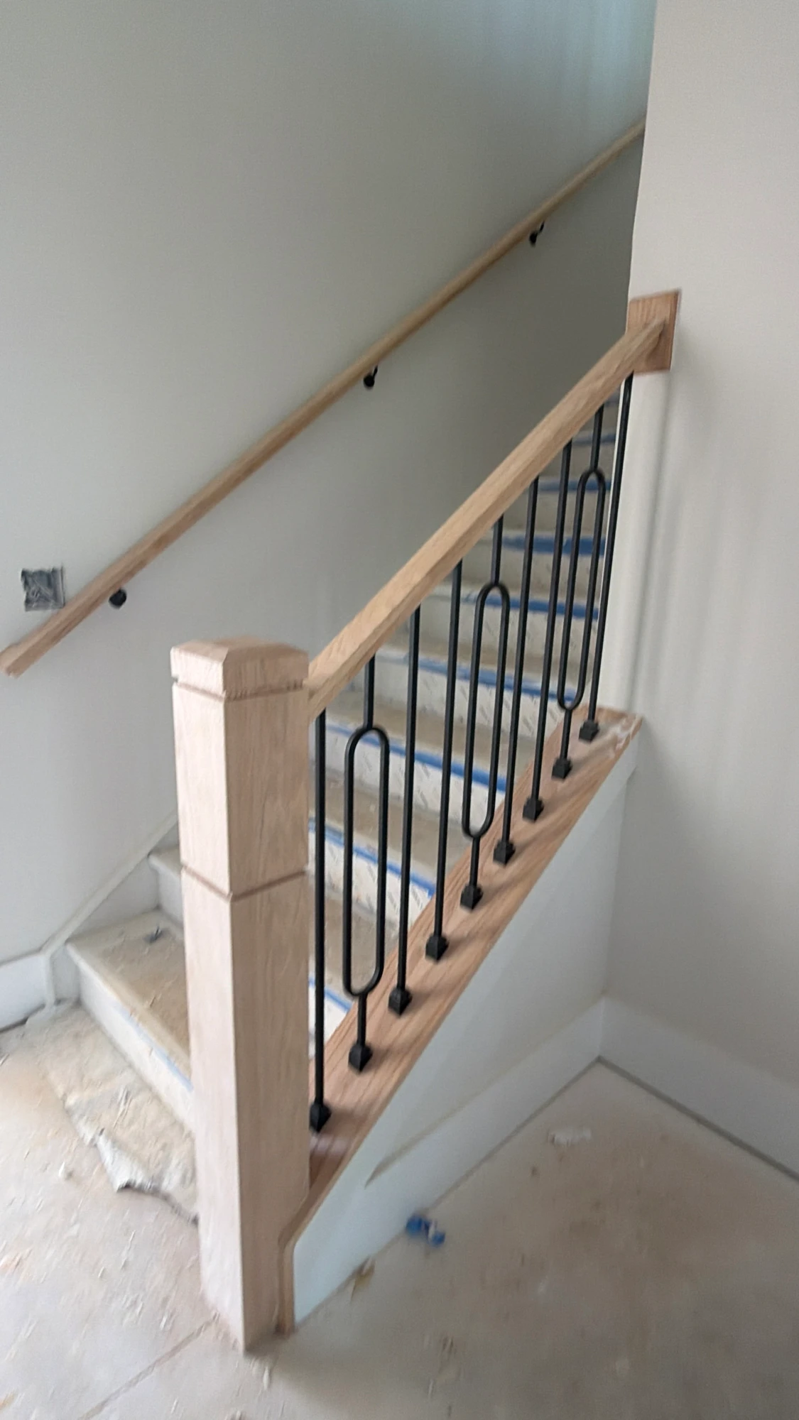 Staircase with iron balusters during construction
